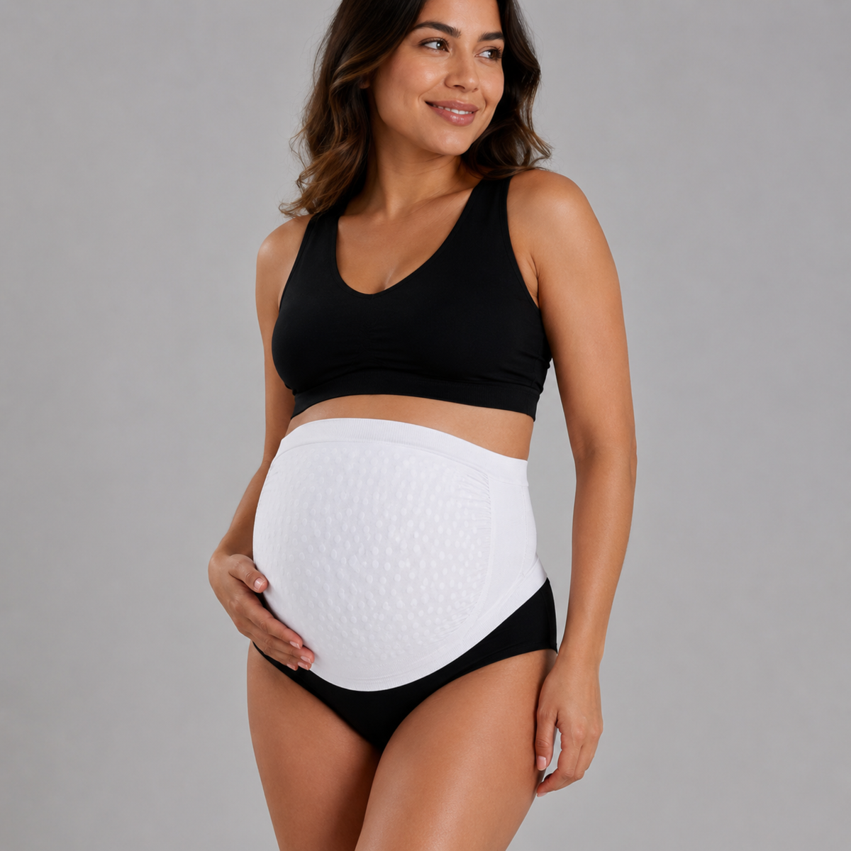 Secret Saviours The Band in white — pregnant model wearing the band over her bump, front view