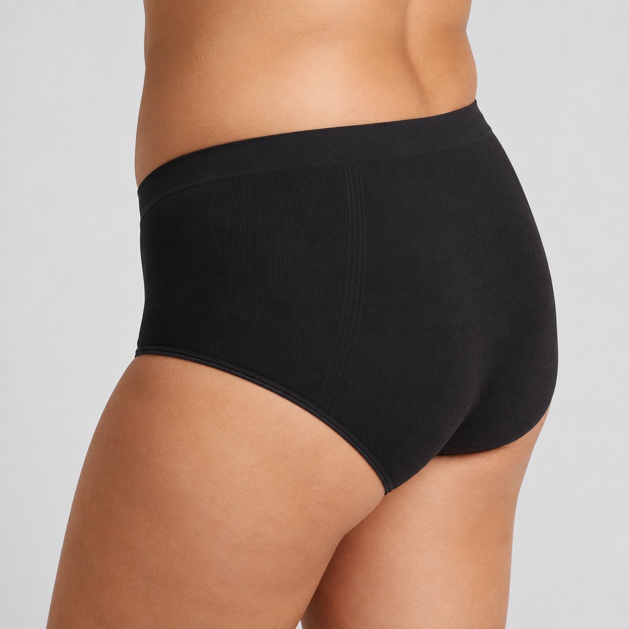 Black high-waisted C-section recovery briefs worn front-on, waistband sitting above the incision line